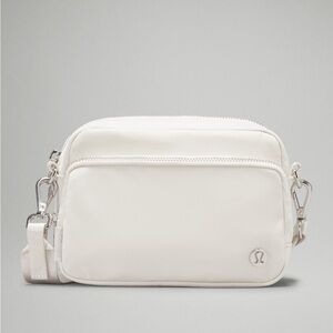 Lululemon Everywhere Crossbody Bag 2 in color Bone/Silver, Like New